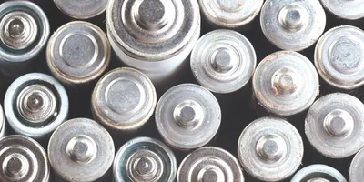 Corroded and mixed used batteries, illustrating the variability in recycled feedstocks that complicates sulfur recovery in battery QA.