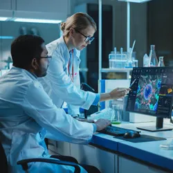 Two scientists in a modern laboratory analyzing a 3D molecular structure on a computer screen, surrounded by lab equipment, emphasizing data-driven research and integrity in scientific analysis.