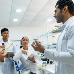 Lab team discussing safety procedures during onboarding