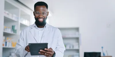 Scientist tracking materials in the lab using a tablet