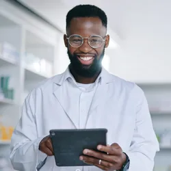 Scientist tracking materials in the lab using a tablet
