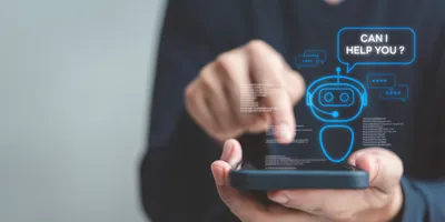 Person interacting with a smartphone interface displaying a chatbot icon and the phrase “Can I help you?”, symbolizing the use of AI tools in scientific or lab environments.