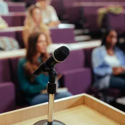 Microphone on podium in a leadership training setting