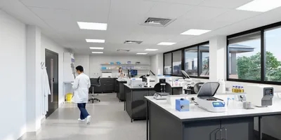 Male scientist walking through modern lab space