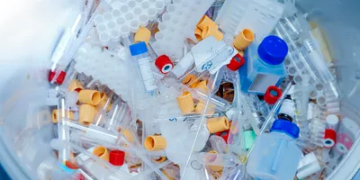 Plastic waste pile illustrating lab sustainability challenges