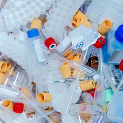Plastic waste pile illustrating lab sustainability challenges