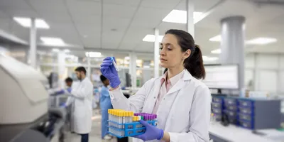  Lab technician analyzing samples for earlier detection of infectious diseases.