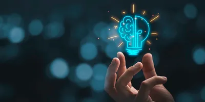 Hand holding drawing virtual lightbulb with brain on bokeh background for creative and smart thinking idea concept