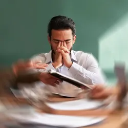 Stressed lab manager during a team meeting