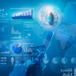 Scientist analyzing data in pharmaceutical lab for domestic manufacturing.