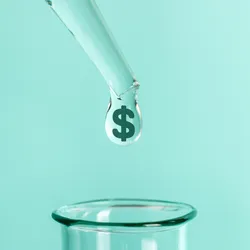 Laboratory pipette dripping dollar sign into a glass container