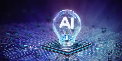 Light bulb with AI text on a circuit board, representing AI-driven research