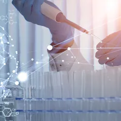 A scientist conducting experiments in a lab, integrating scientific software in analytical chemistry.