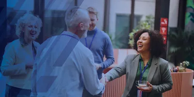 Lab leaders shaking hands at a conference