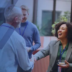 Lab leaders shaking hands at a conference