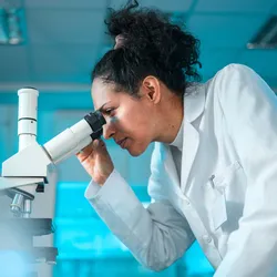 Researcher using analytical instrumentation for biotechnology research