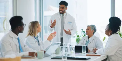 A team of lab professionals discussing scenario planning strategies.