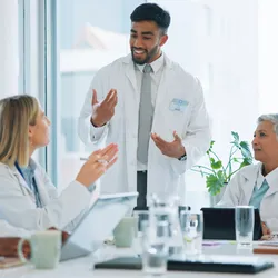 A team of lab professionals discussing scenario planning strategies.