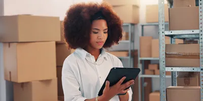 Scientist noting details during a lab move