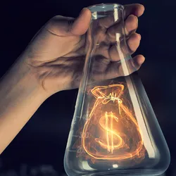 Flask with a dollar sign, symbolizing financial support for research initiatives.