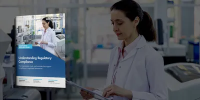 Latin American doctor reading some tests results on a clipboard while working at the laboratory