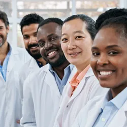 Diverse professionals in a laboratory, reflecting people-first leadership principles