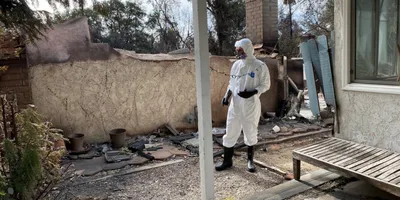 Emergency response team evaluating post-wildfire environment