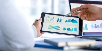 Person analyzing KPIs on a tablet