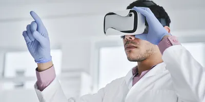 Person in VR headset demonstrating virtual reality training in a lab
