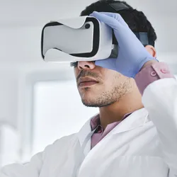 Person in VR headset demonstrating virtual reality training in a lab