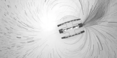 Microscopic autonomous robots in fluid demonstrating movement