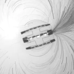 Microscopic autonomous robots in fluid demonstrating movement