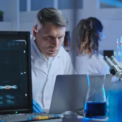 Researcher evaluating AI models in a laboratory setting