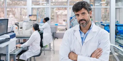 Laboratory manager overseeing staff in lab environment