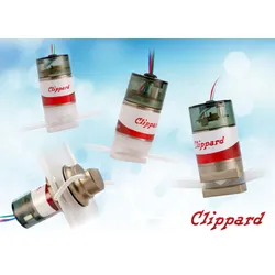 Five small Clippard electronic valves with red-and-white labels shown at different angles against a light blue, abstract background; colored wires extend from the tops and clear tubing connects to the fittings.
