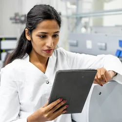 Laboratory automation in action with technician using technology