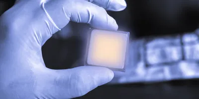 Researcher with a microelectronic chip showing electronic chirality