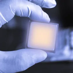 Researcher with a microelectronic chip showing electronic chirality