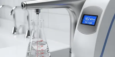 Lab water purification system dispensing ultrapure water.