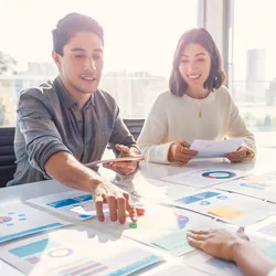 Team collaborating on strategic planning for the lab