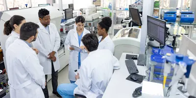 Lab team discussing scenario planning for operations