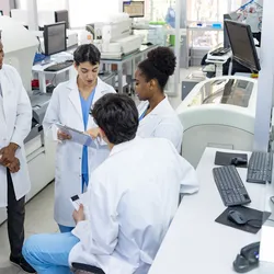 Lab team discussing scenario planning for operations