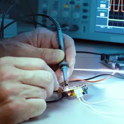 Technician working with NRTL test equipment