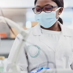A researcher in a lab focusing on occupational health and safety