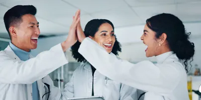 Laboratory staff engaging in recognition and celebration