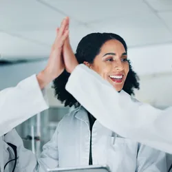 Laboratory staff engaging in recognition and celebration