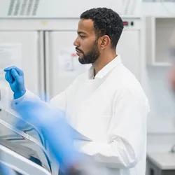 Laboratory technician utilizing mcPCR technology for DNA analysis