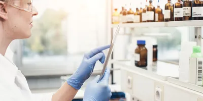 scientist taking inventory of laboratory supplies