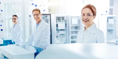 Three lab technicians applying their strengths in a modern laboratory.