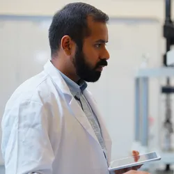 Lab technician analyzing data using AI